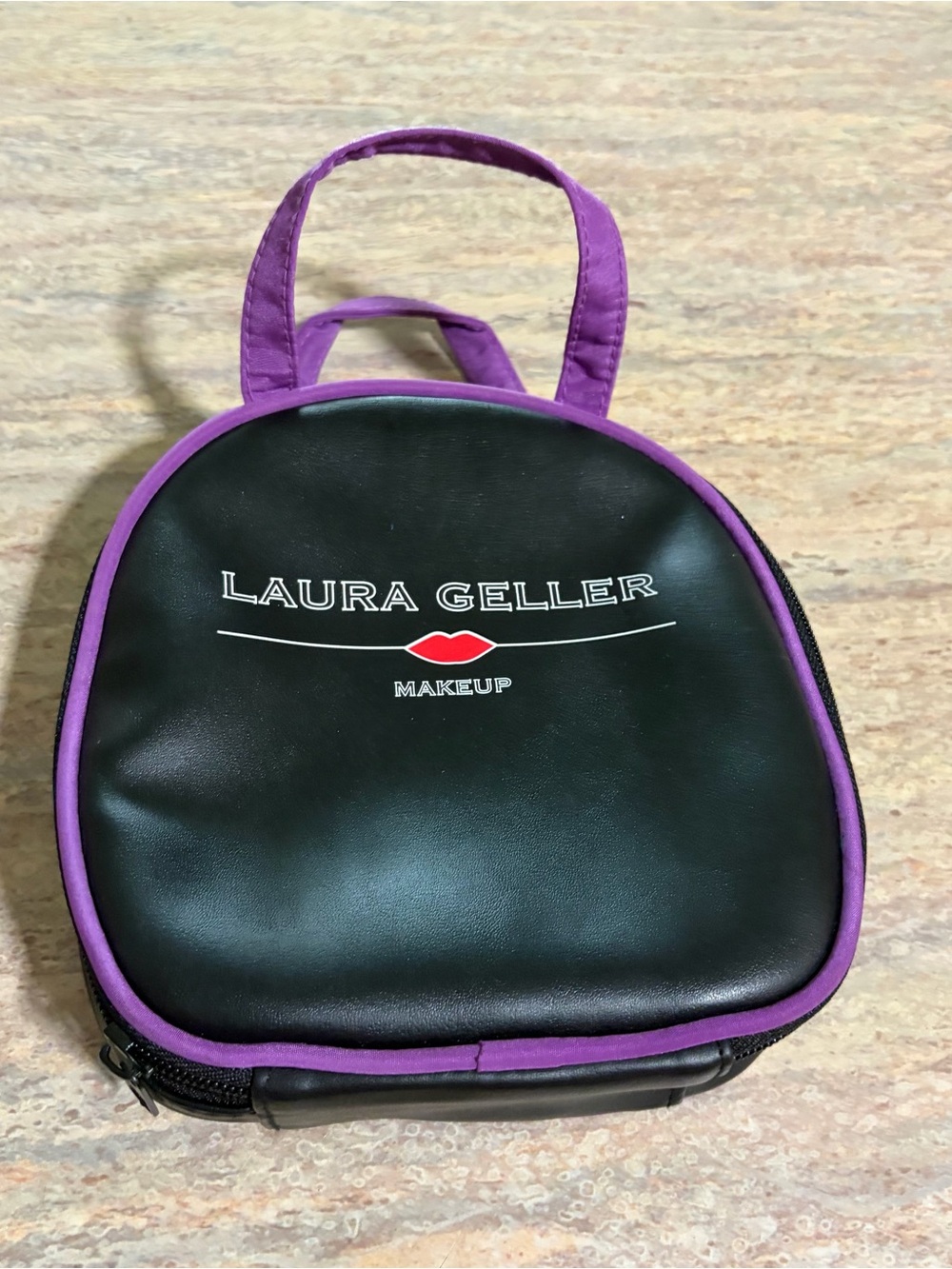 Laura Geller Black Cosmetic Bag with Purple Trim and Handles